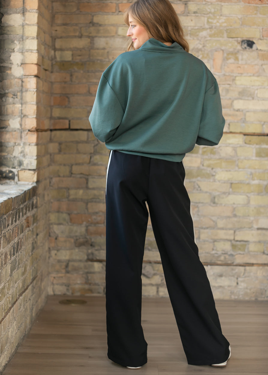 Pantalones deportivos Nina de pernera ancha
