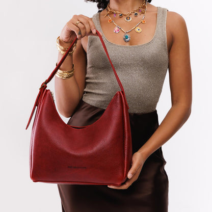 https://cdn.shopify.com/s/files/1/0712/1227/files/aspen-shoulder-bag-medium-chili-red-studio-25-07-23-1913-Edit.jpg?v=1770413200