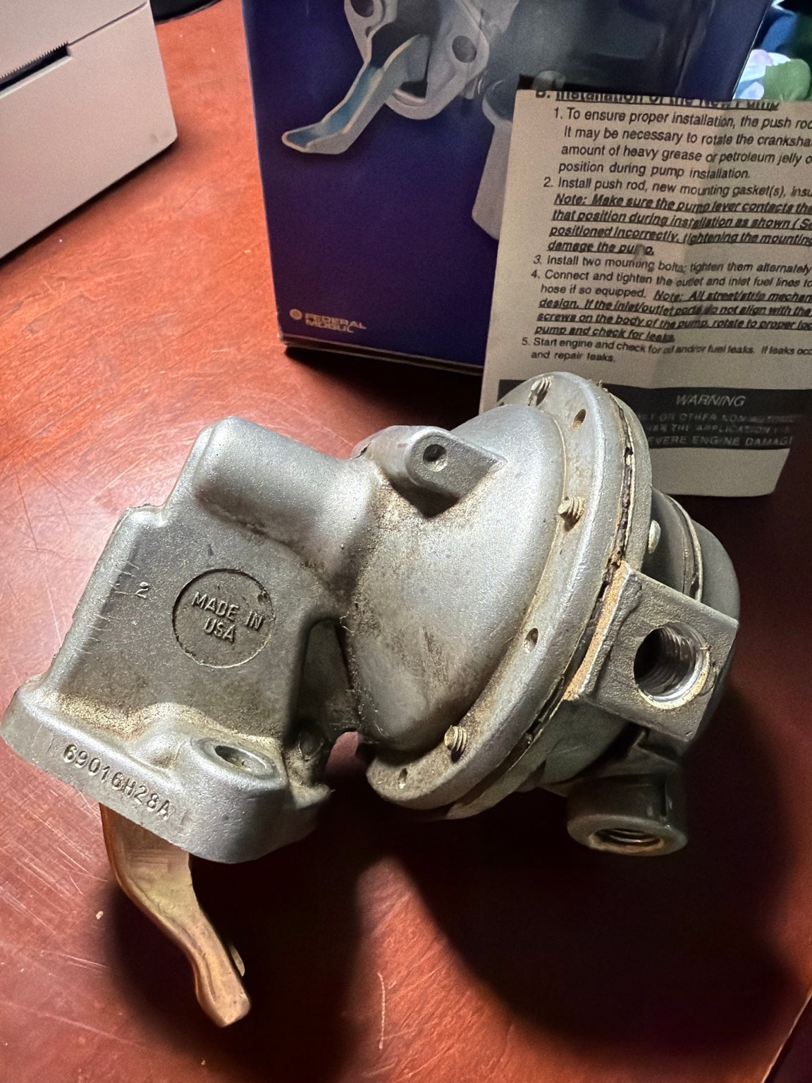 Carter mechanical fuel pump close-up showing Made in USA and 6901GH28A casting mark