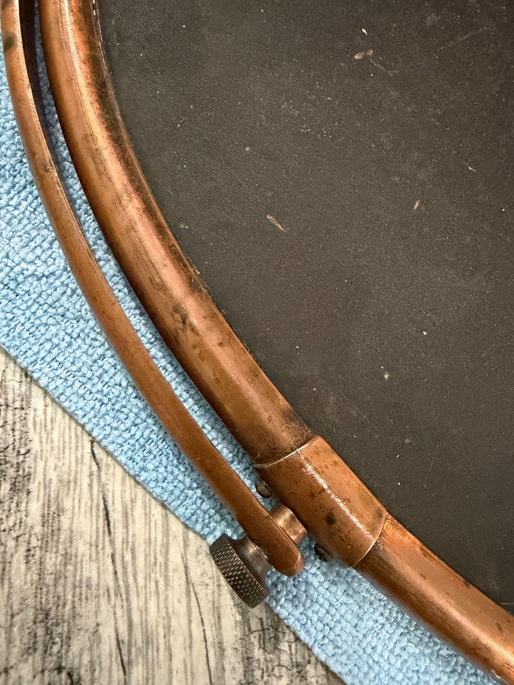 Close view of patina and wear on mirror frame