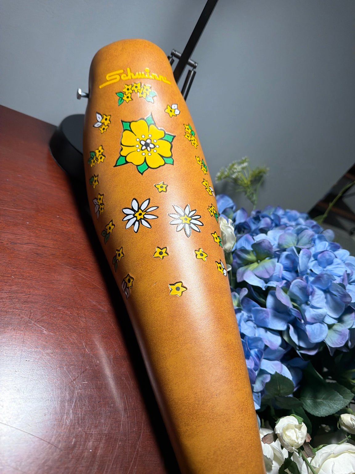 Close-up of Schwinn floral banana seat logo and flower graphics