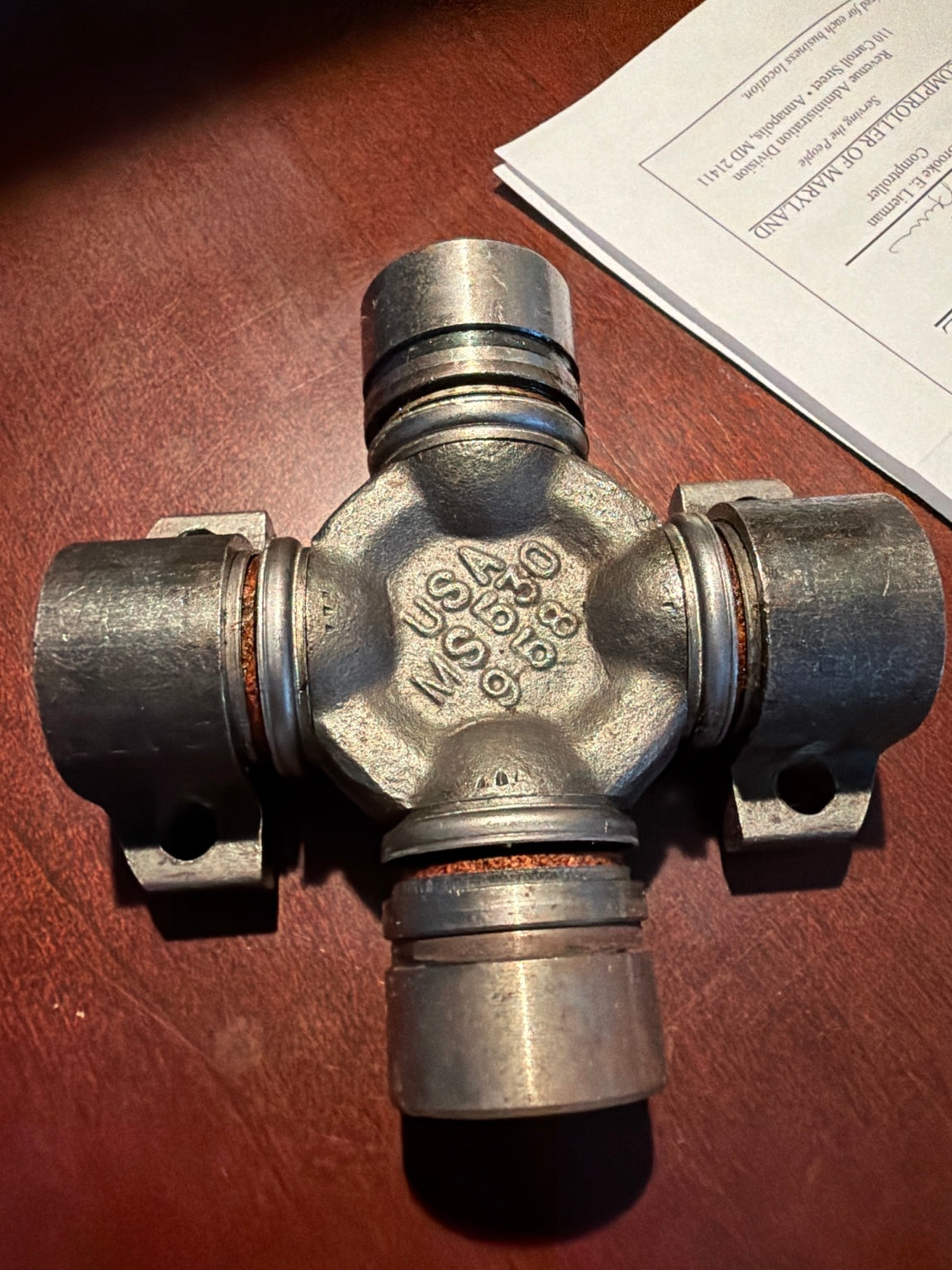 Universal joint 565988 close-up showing USA MS630 9.58 casting mark